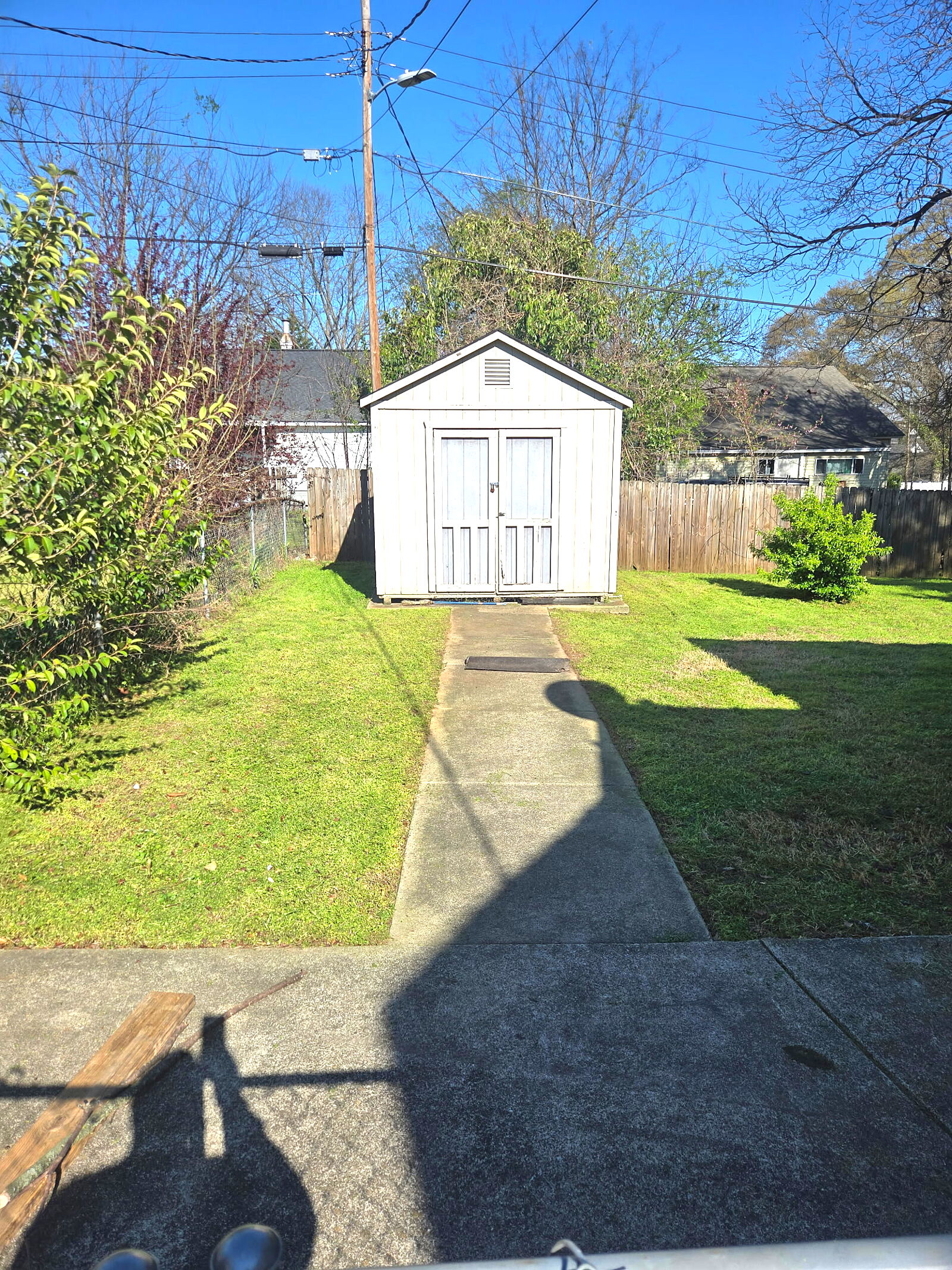 Freshly mowed backyard with shed in the Upstate of South Carolina
